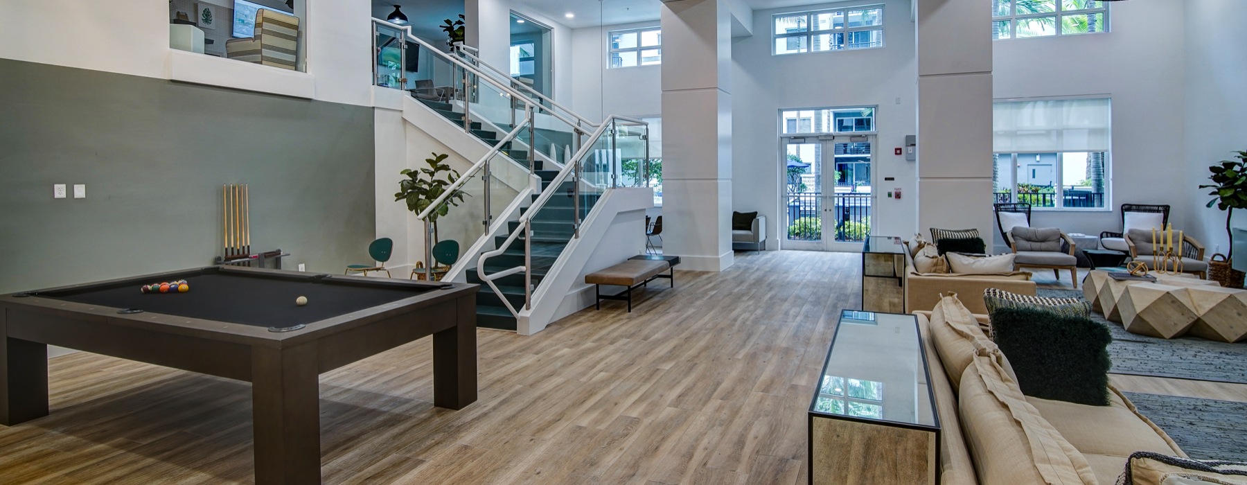 Resident lounge with gaming table and seating